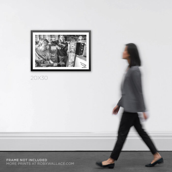20x30 wide framed punk rock documentary Graphic Design print Greg Ginn and Mike Vallely at the SST Records warehouse, displayed on an art gallery wall for scale.