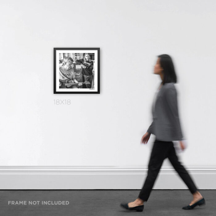18x18 square framed punk rock music Graphic Design print featuring Greg Ginn and Mike Vallely at SST Records, styled on an interior wall to show product scale.