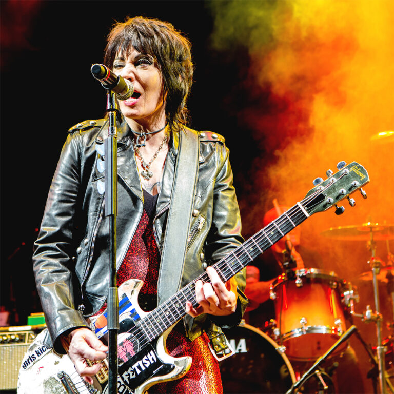 punk rock music Graphic Design by RobxWallace icon Joan Jett performing live with a custom guitar at the YSL after-party inside the Hollywood Palladium.