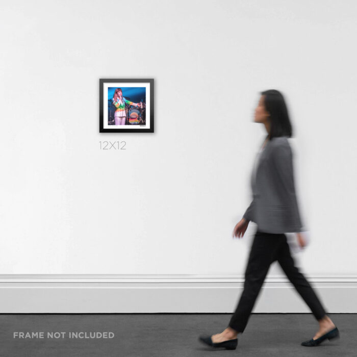 12x12 square framed alternative rock concert print focusing on Jenny Lewis in her signature rainbow outfit at The Observatory, styled in a home layout to display product scale.