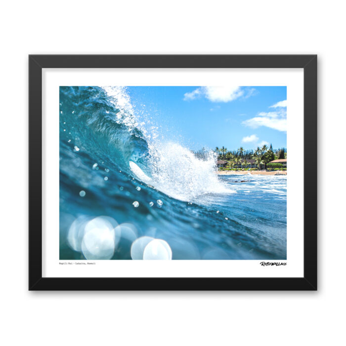 Detailed close up of a 16x20 wide framed premium surf poster print documenting a flawless hollow barrel over a vibrant reef line in Lahaina, Maui.