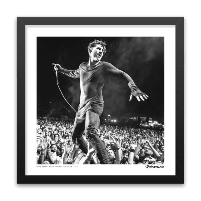Close up view of an 18x18 square framed alternative rock poster print showcasing frontman Davey Havok connected with the crowd at FivePoint Amphitheatre.