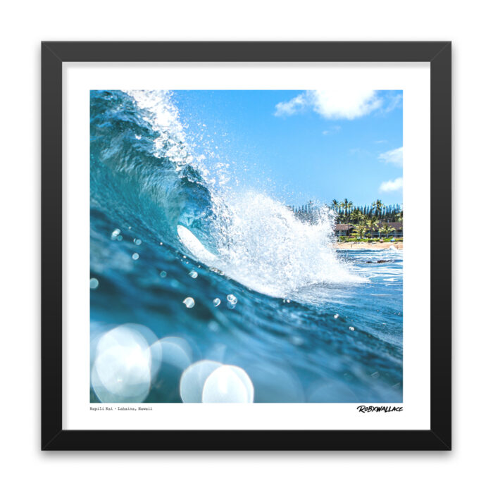 Close up view of an 18x18 square framed surf Graphic Design print featuring a crisp turquoise barrel morning sunlight with a lush Hawaiian island backdrop.
