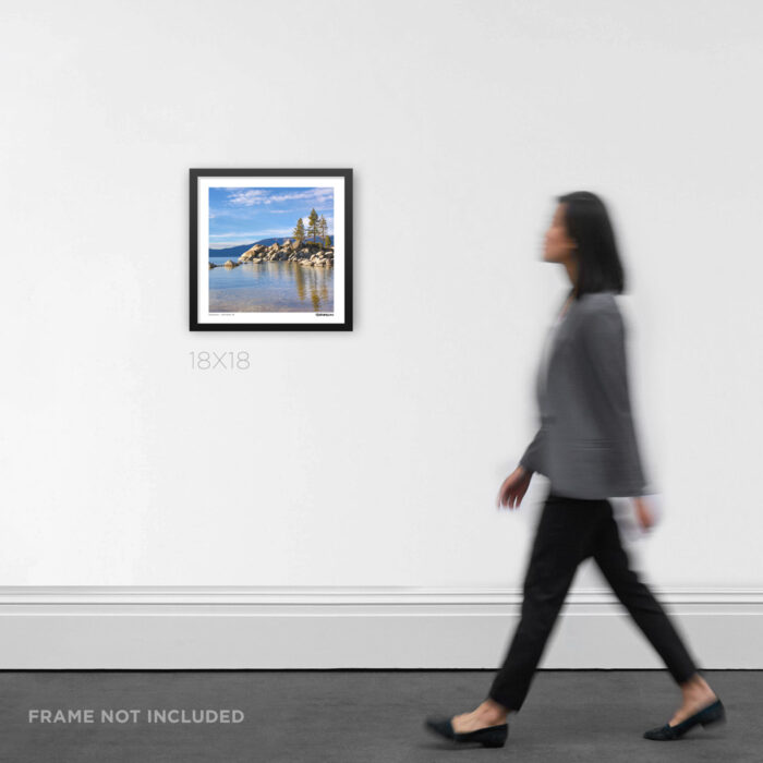 18x18 square framed nature photo print the tranquil turquoise water and vibrant greenery of Lake Tahoe, styled on a gallery wall for scale.