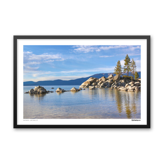 Close up view of a 24x36 wide framed landscape poster print showcasing a golden evening light over the smooth boulders and Sierra Nevada mountains at Lake Tahoe.