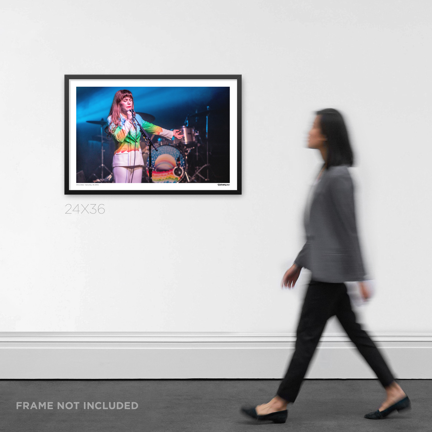 24x36 wide framed indie rock concert Graphic Design print Jenny Lewis live in her signature rainbow suit at The Observatory OC, displayed on a wall for product scale.
