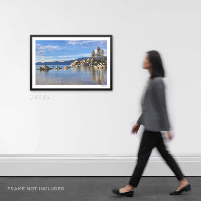 24x36 wide framed nature Graphic Design print the crystal clear water and granite rocks of Sand Harbor at Lake Tahoe, displayed on an art gallery wall for scale.