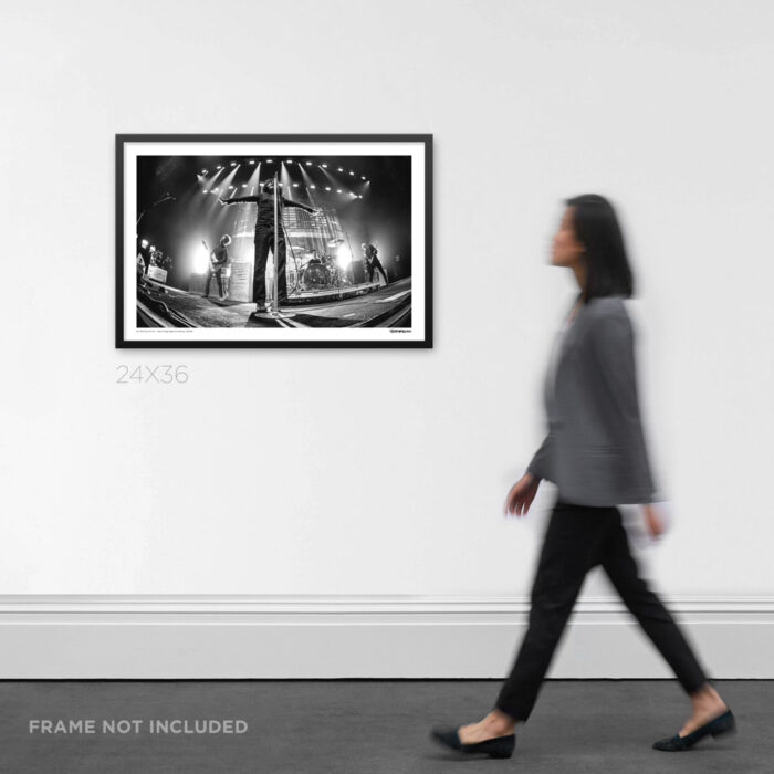 24x36 wide framed post-hardcore music Graphic Design print Cedric Bixler-Zavala of At The Drive-In with arms wide open on stage, displayed on a gallery wall for scale.