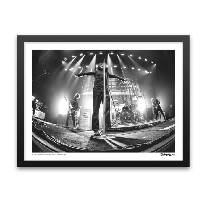 Detailed view of an 18x24 wide framed music history wall art print tracking the kinetic energy of vocalist Cedric Bixler-Zavala mid-performance.