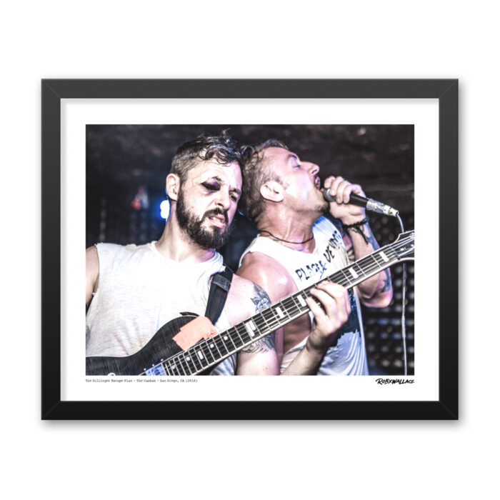 Detailed close up of a 16x20 framed avant-garde metal poster print the live chaos and technical precision of Ben Weinman and Greg Puciato at a packed San Diego venue.