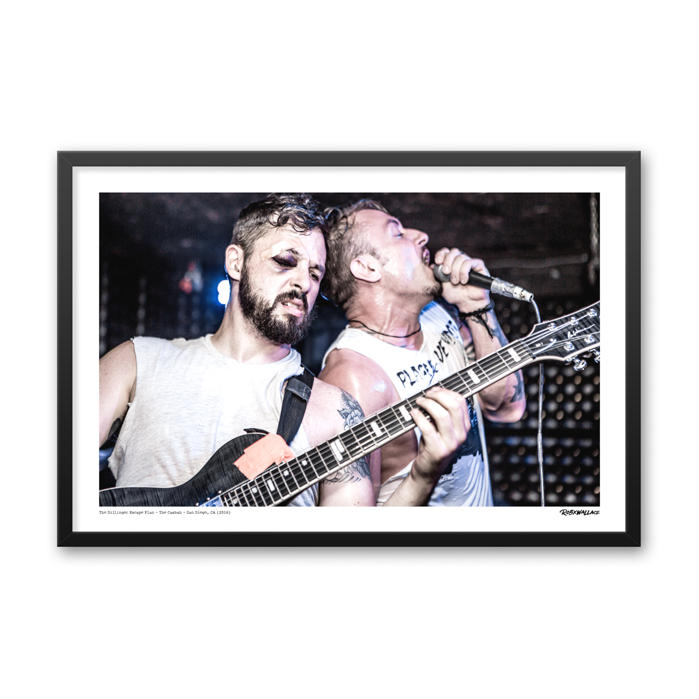Close up view of a 24x36 framed experimental metal poster print featuring a black-eyed Ben Weinman shredding next to vocalist Greg Puciato during their final club run in 2016.