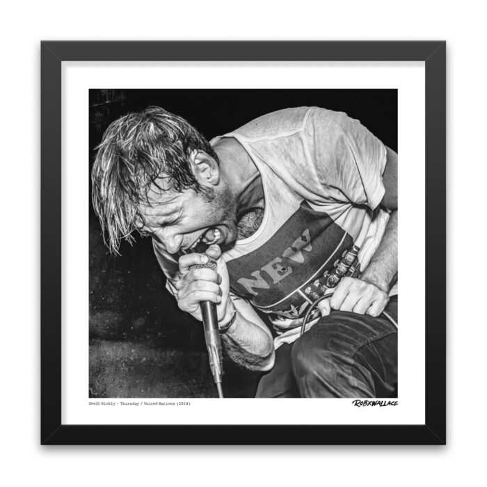 Close up view of an 18x18 square framed hardcore punk poster print frontman Geoff Rickly of Thursday performing with his supergroup United Nations.