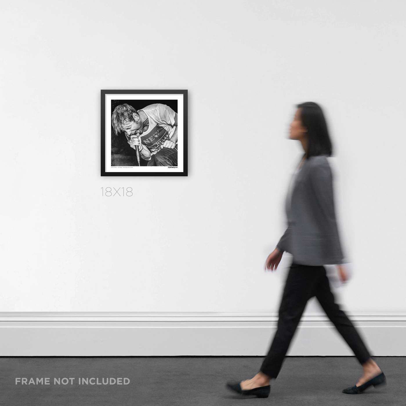 18x18 square framed punk rock music Graphic Design print Geoff Rickly screaming into the microphone live with United Nations, displayed on a wall for product scale.