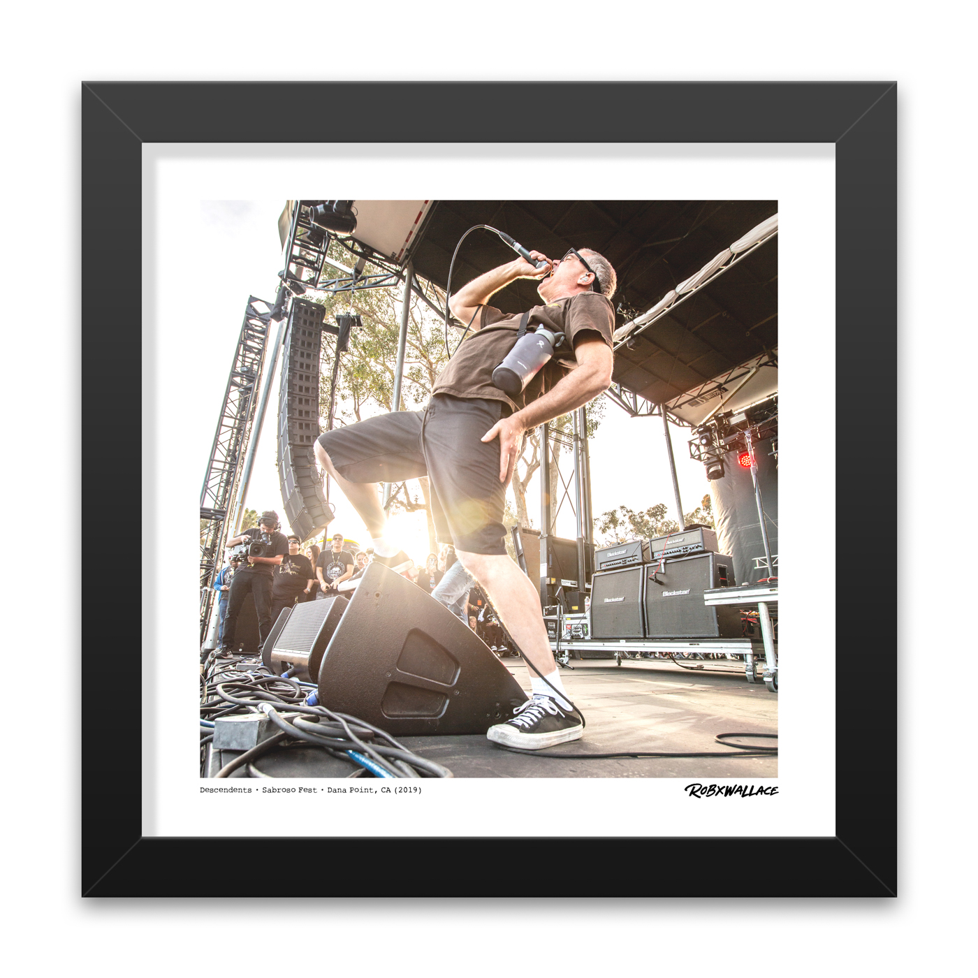 Detailed close up view of a 12x12 square framed fine art music poster print of vocalist Milo Aukerman delivering an intense punk performance.