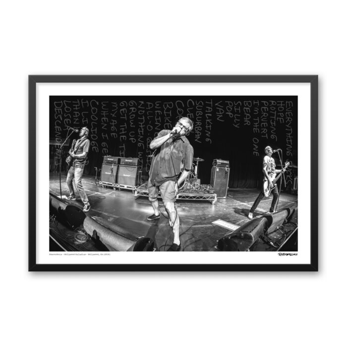 Close up view of a 24x36 framed punk rock poster print the Descendents live on stage during their 2016 reunion tour with handwritten setlist background detail.