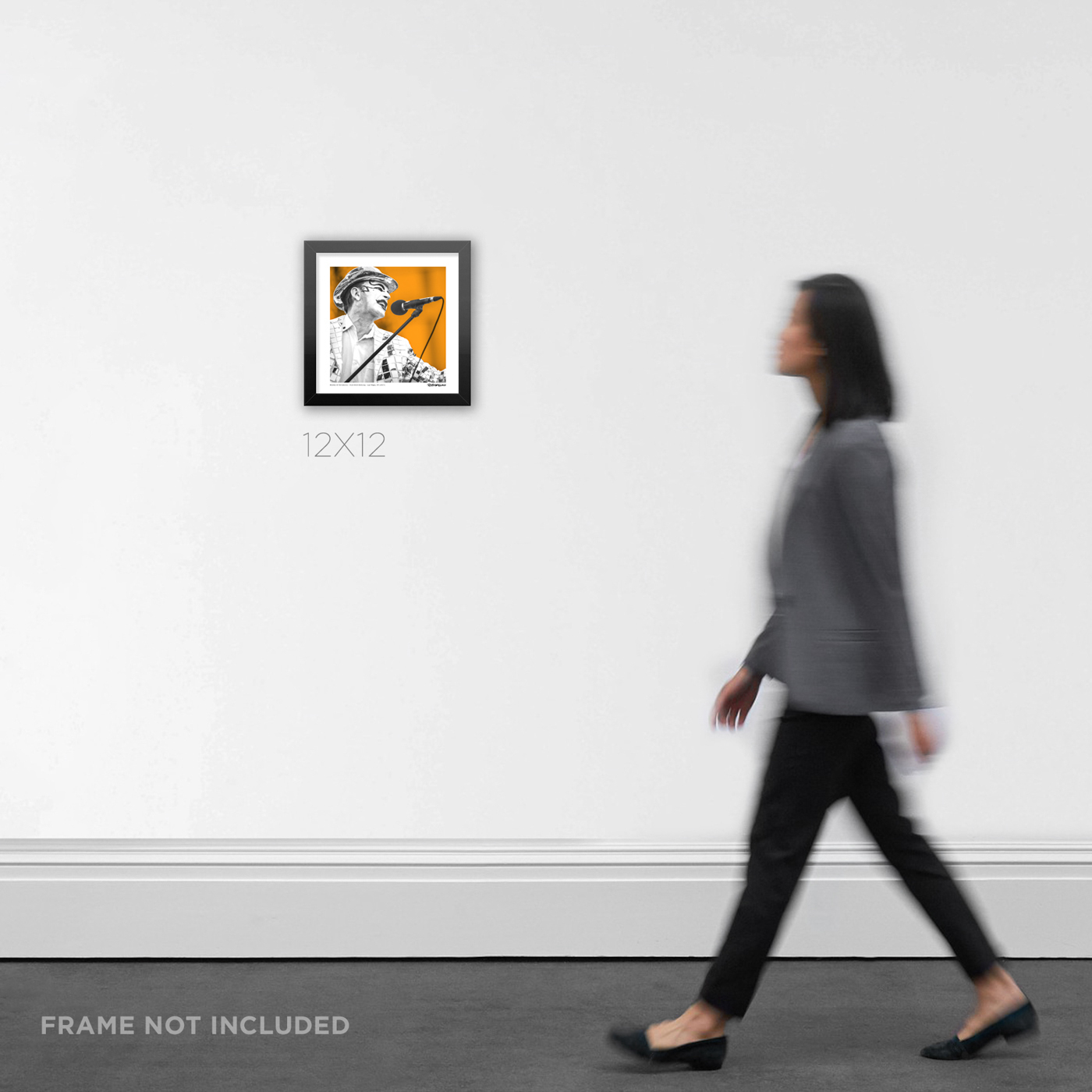 12x12 square framed street punk art print documenting Keith Monkey Warren live at Punk Rock Bowling by RobxWallace, displayed in a modern home room for scale.