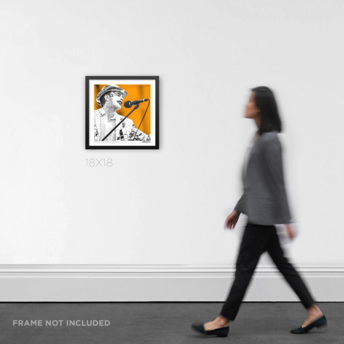 18x18 square framed punk rock music Graphic Design print featuring Monkey Warren of The Adicts in a bright orange pop-art style, hanging on a gallery wall for scale.