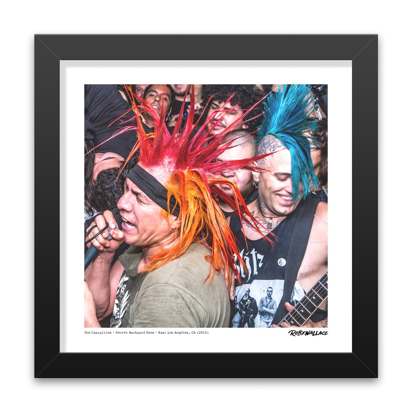 Detailed close up look at a 12x12 square framed fine art punk poster print showcasing vocalist Jorge Herrera and guitarist Jake Casualty playing an intense, politically conscious live set.