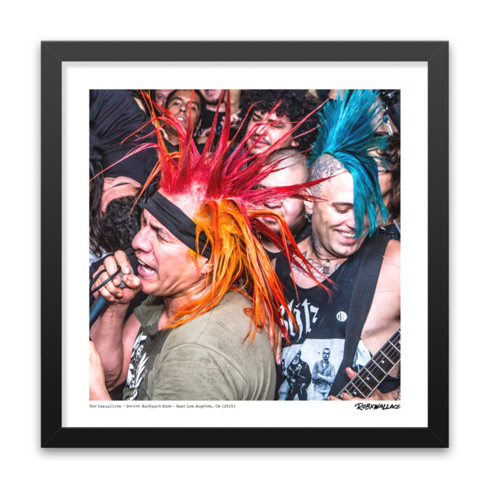 Close up view of an 18x18 square framed punk rock concert print the , chaotic energy of The Casualties performing live at a last minute backyard show right before the police shutdown.