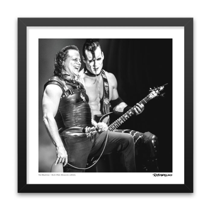 Close up of an 18x18 square framed music documentary print focusing on a lighter, genuine moment between Glenn Danzig and Doyle von Frankenstein during their thunderous set.