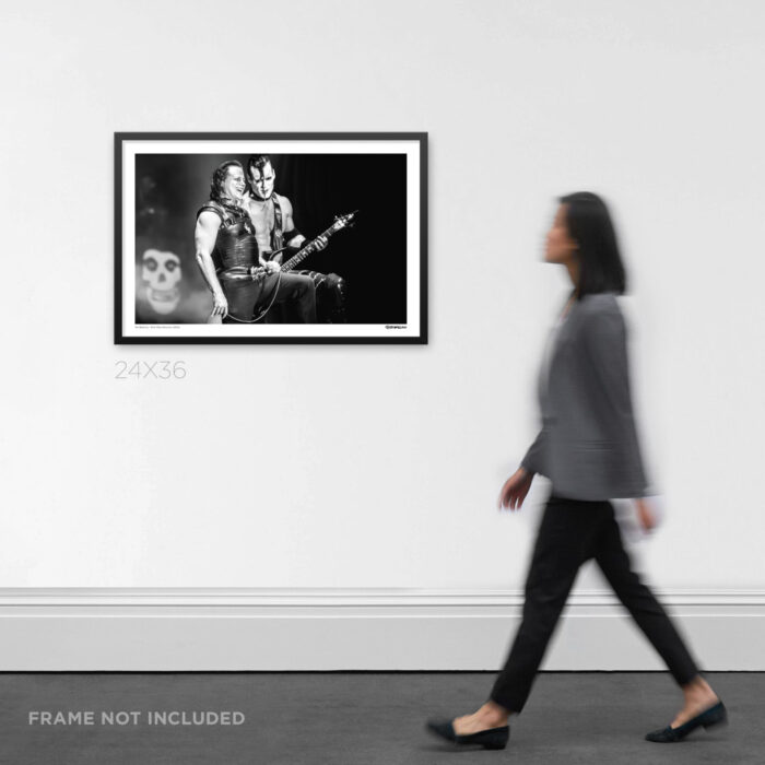 24x36 wide framed black and white punk Graphic Design print a rare candid moment between Glenn Danzig and Doyle live at Riot Fest Denver, displayed on a gallery wall for scale.