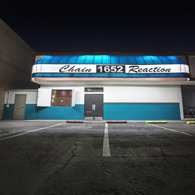 Square fine art Graphic Design print of the Chain Reaction music venue external facade at night in Anaheim California.